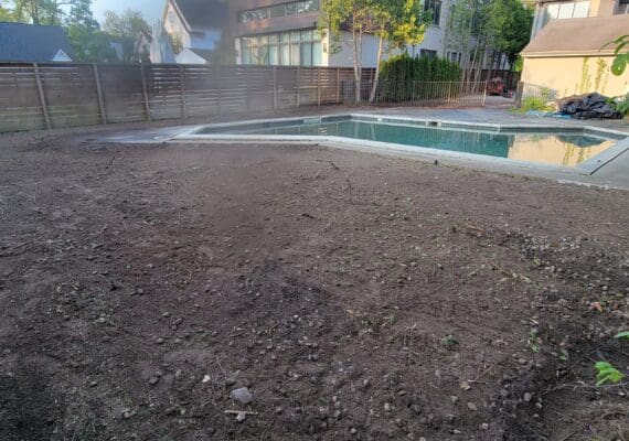 Tatra Built team performing grading and excavating for landscape project in Macomb
